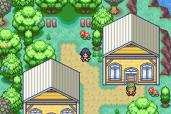 Nyx exploring a town with green-roofed houses and flowering trees